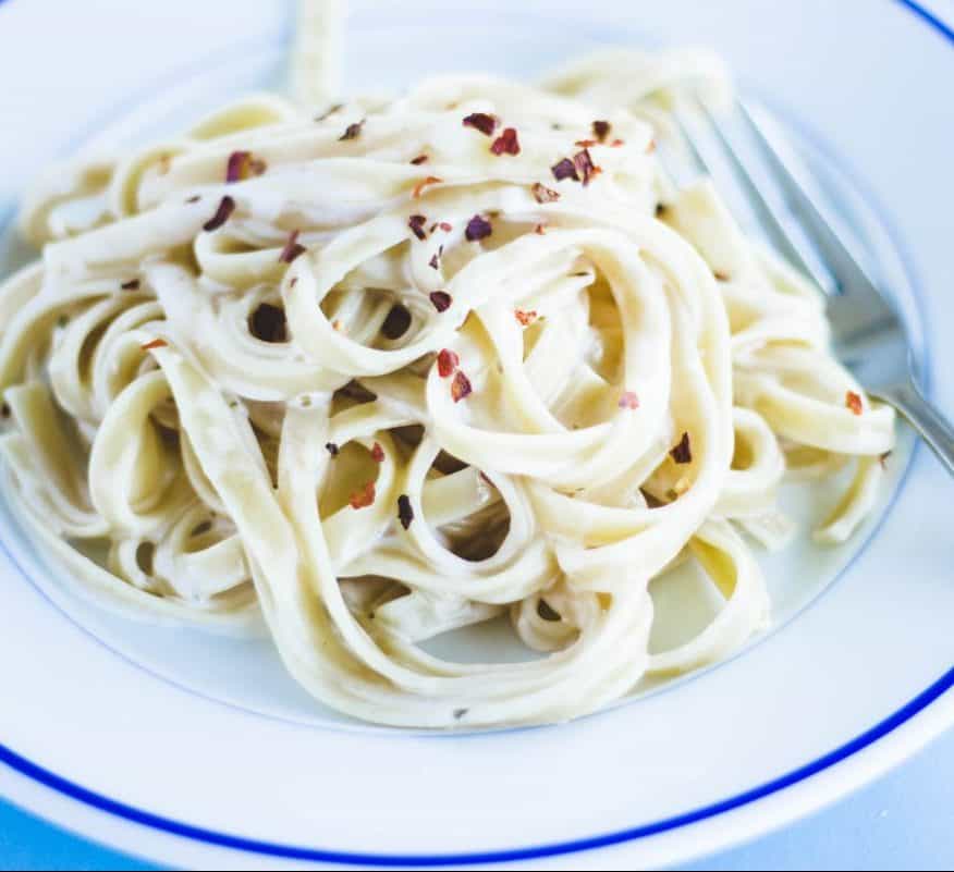 Fettuccini Alfredo toped with pepper flakes