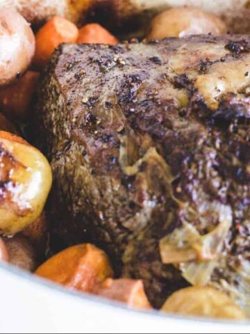 Succulent Rib Roast and potatoes in a dutch oven