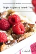 maple french toast topped with raspberries.