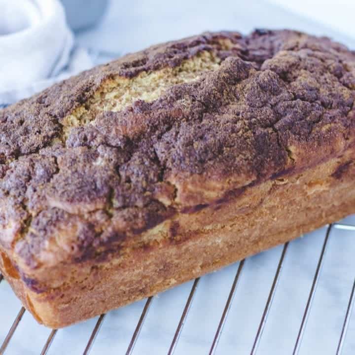 loaf of breakfast bread cooling on wire rack