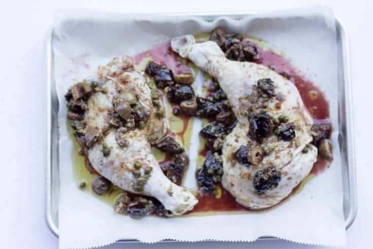 uncooked chicken on sheet pan