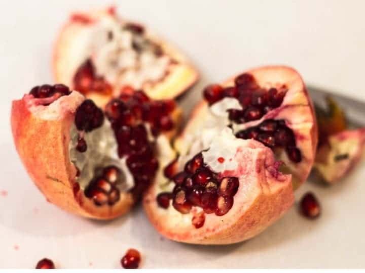 pomegranante cut open to expose the seeds