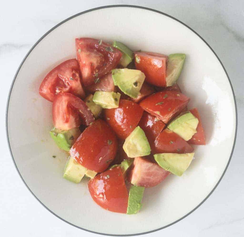 bowl of ripe tomato and avocado salad
