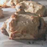 Plain scones on baking sheet.