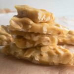stack of peanut brittle on parchment paper