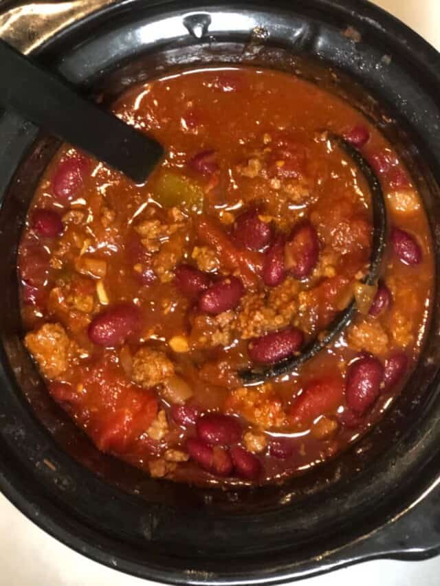Homemade chili cooking in slow cooker.