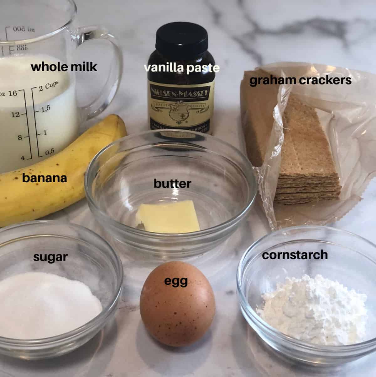 banana pudding ingredients; sugar, milk, cornstarch, egg yolk,vanilla paste, butter, graham crackers and banana.