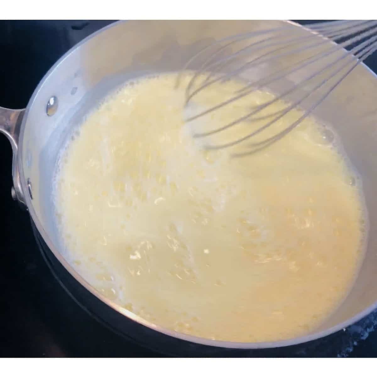 pudding cooking in saucepan.