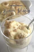 banana pudding in clear glass dessert cup.