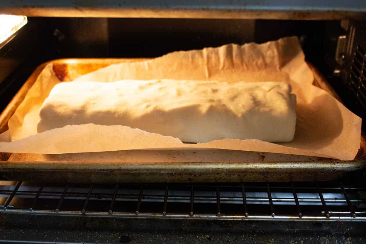 Appple strudel baking in oven.
