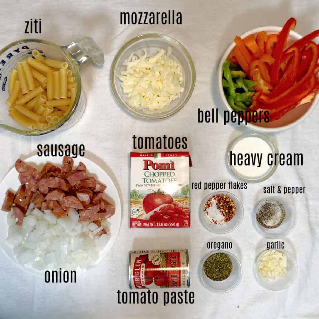 ingredients to make slow cooker sausage and peppers in a 3-quart slow cooker.