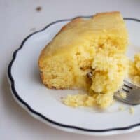 slice of cornbread on white plate.