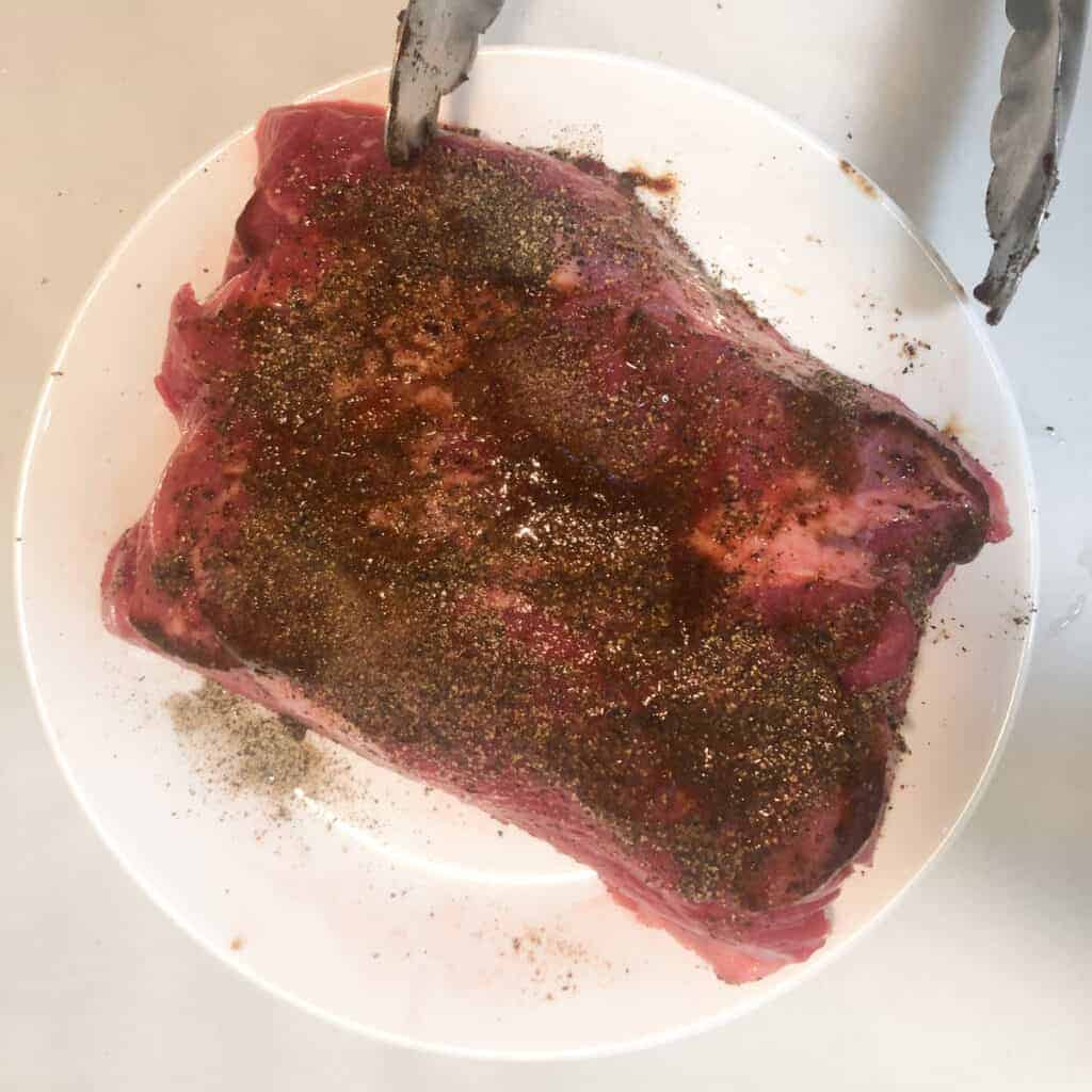 seasoned tri tip rubbed with steak sauce.