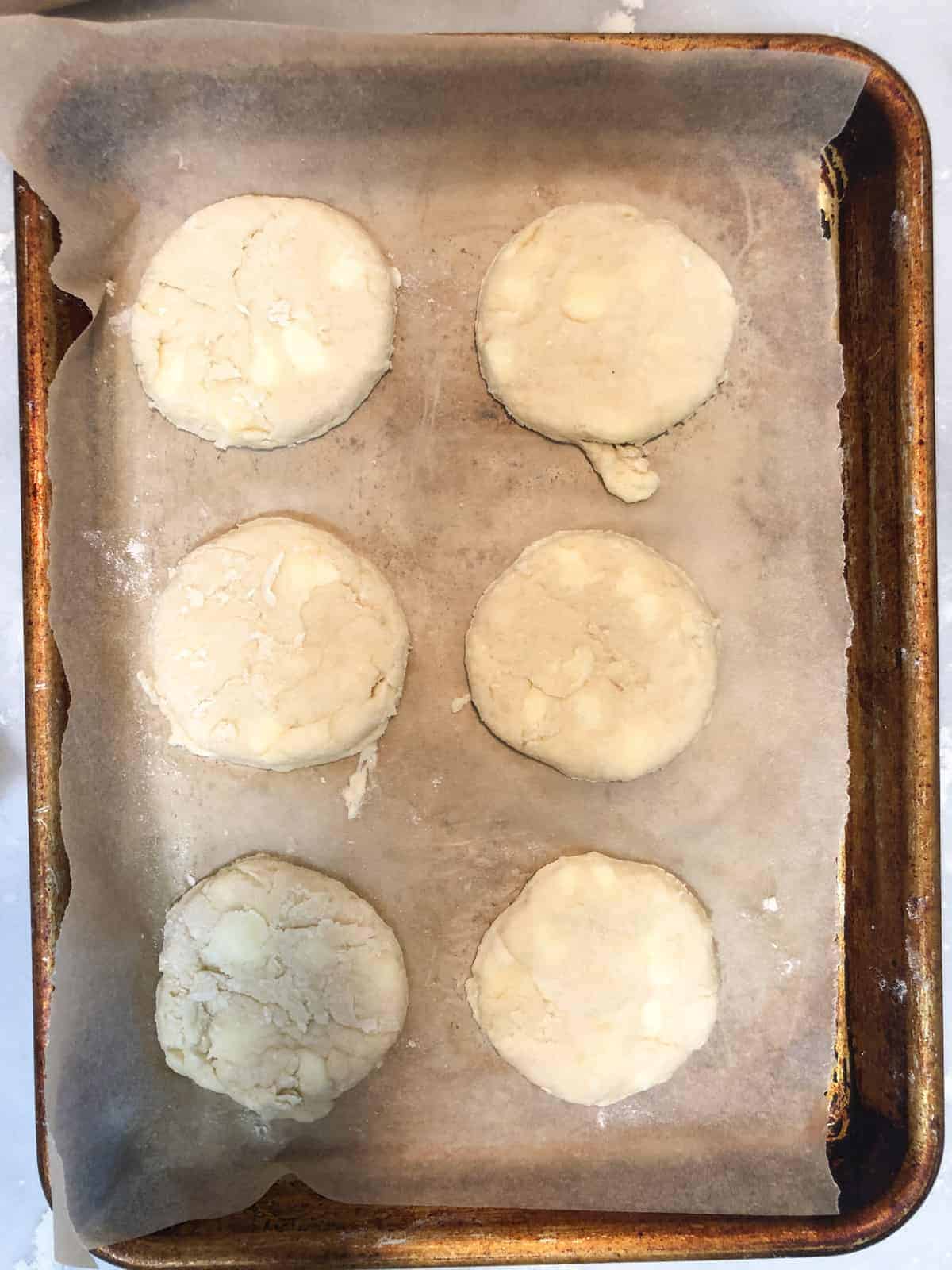 breakfast biscuits on parchment lined baking sheet.