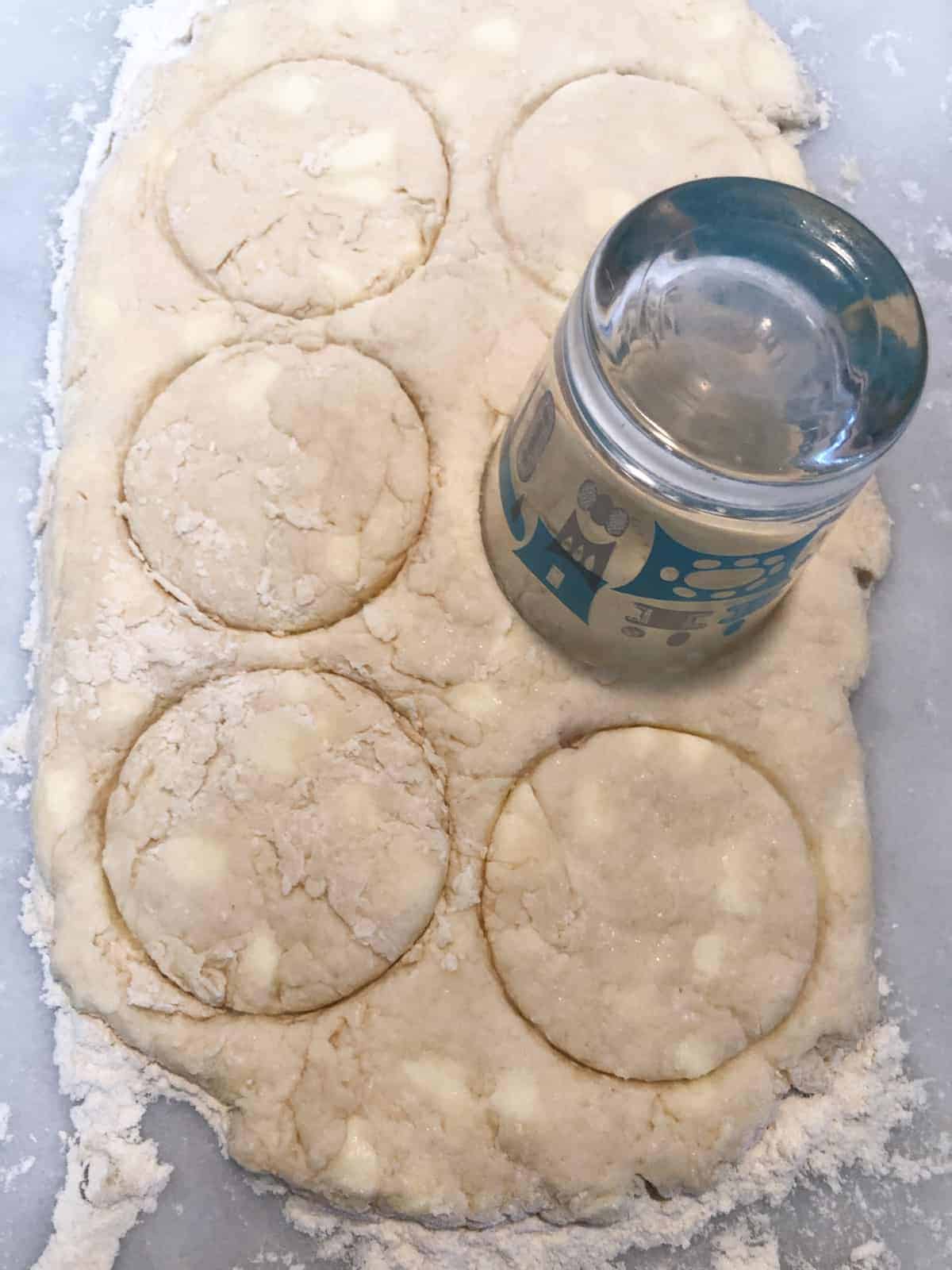 breakfast biscuit dough cut out in round..