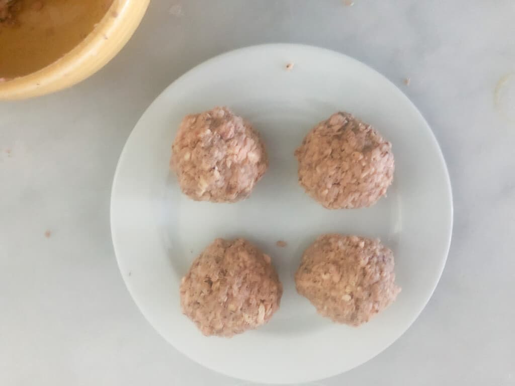 canned salmon rolled into four balls.