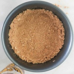 Graham cracker crust in springorm pan.