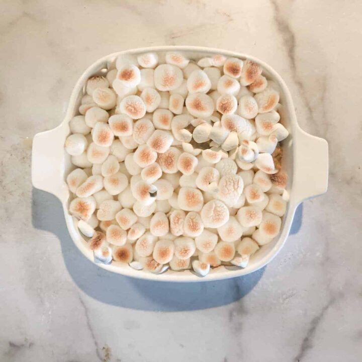 Small baking dish of yams covered in marshmallows.