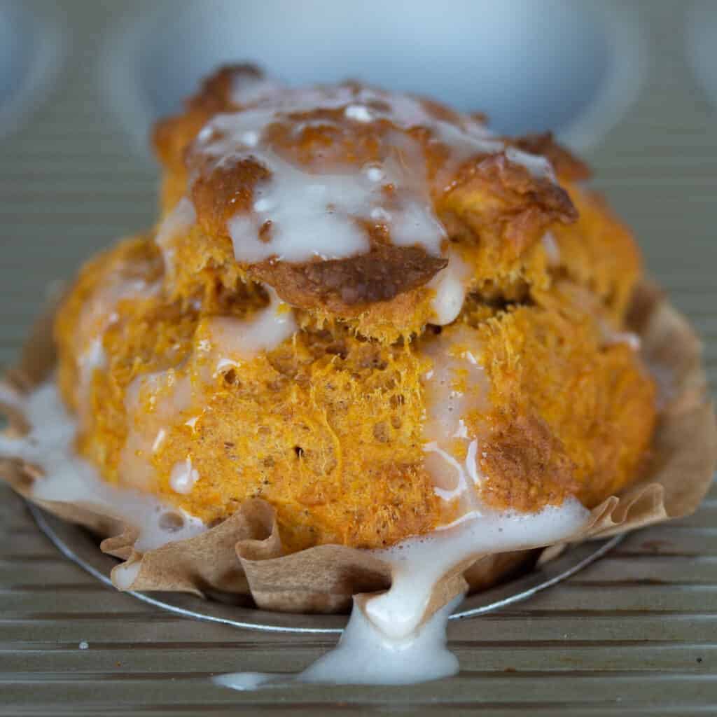libbys pumpkin muffin drizzled with powdered sugar glaze.