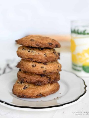 Bisquick chocolate chip cookies stacked on plate.
