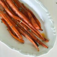 Baked carrots on oval serving dish.