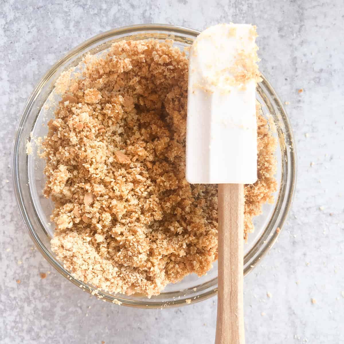 graham cracker cumbs in small bowl.