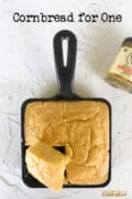 Baked cornbread in small square cast iron skillet.
