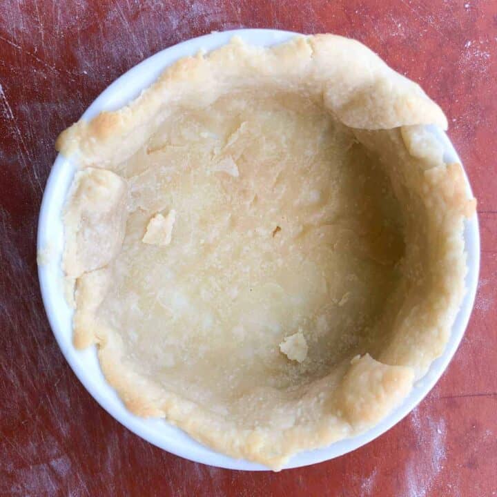 Unbaked Pie crust in ramekin.