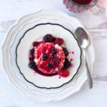 Baked ricotta covered in raspberry sauce.