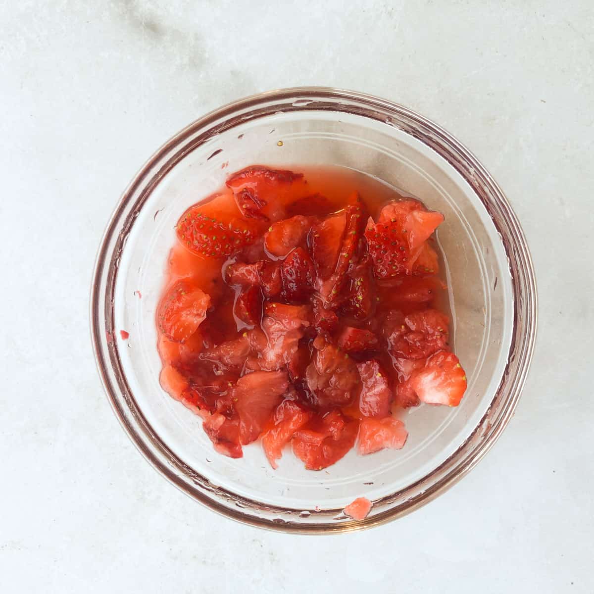 Mashed strawberries in bowl