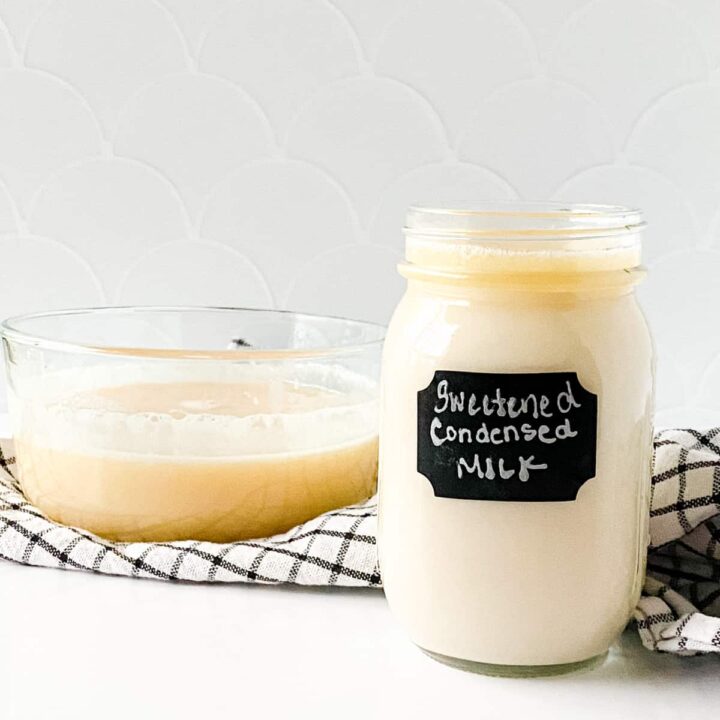 Mason jar with chalkboard label and filled with sweetened condensed milk.