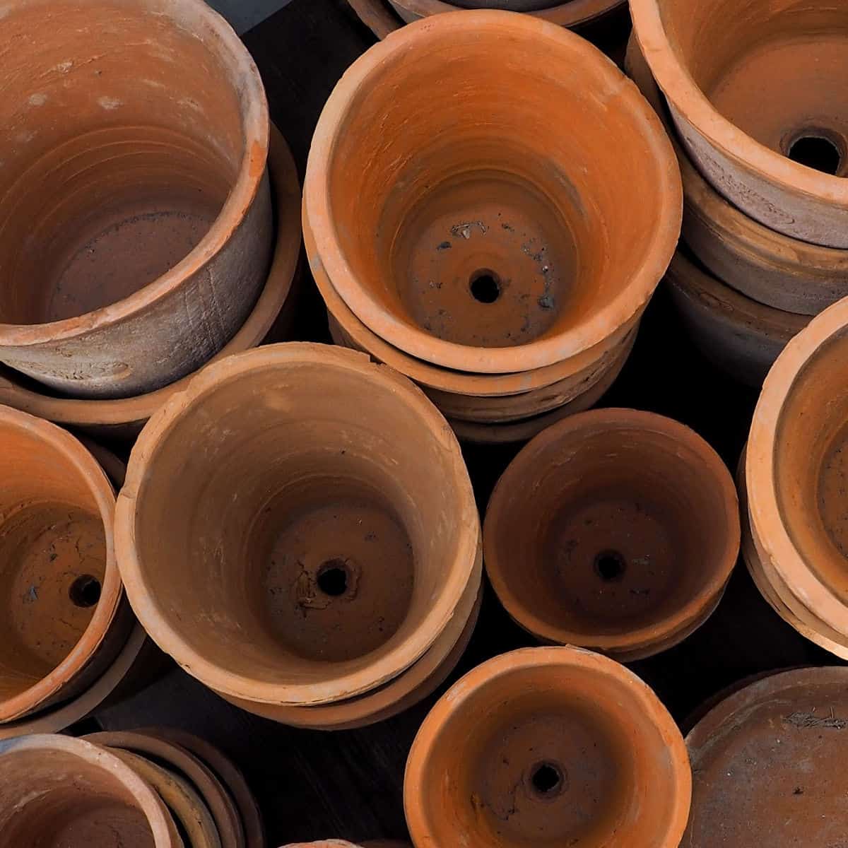 stacks of terra cotta containers.