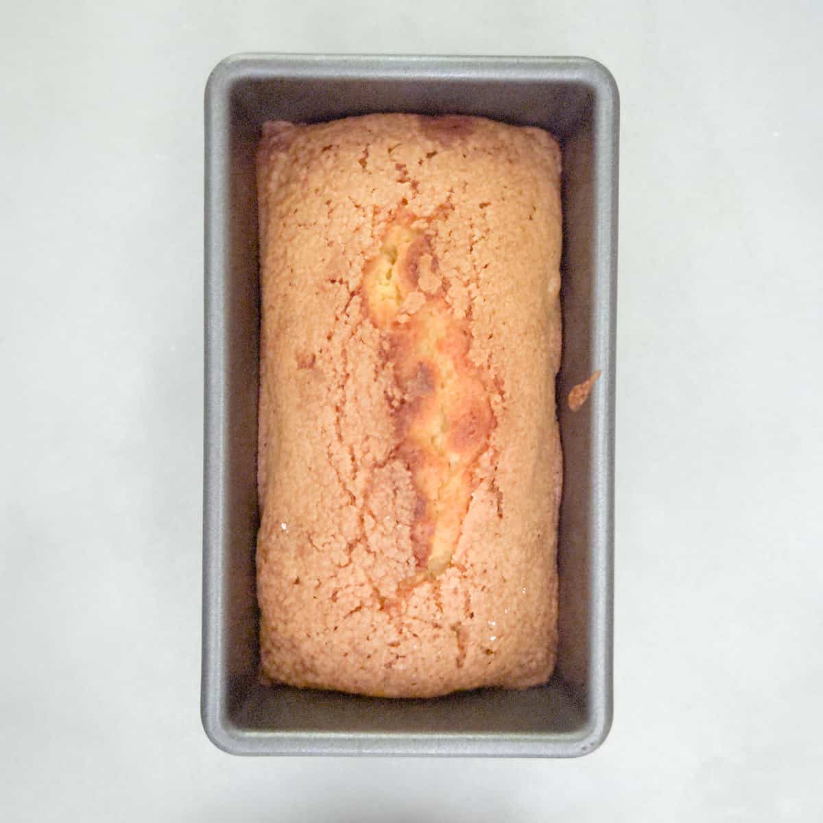 Baked pound cake in loaf pan.