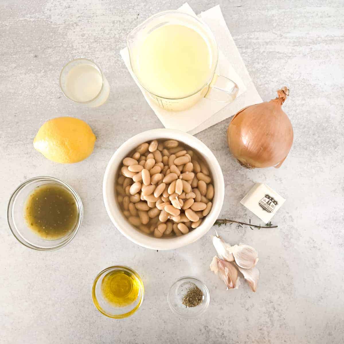 Canned beans and seasonings on table.