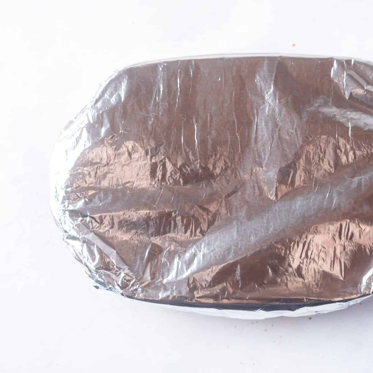 Small rectangular baking dish covered in aluminum foil.