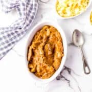 Oval white dish filled with beef stroganoff.