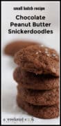 Stack of chocolate peanut butter snickerdoodle cookies on parchment paper.