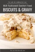 Biscuit covered in sausage gravy on plate.