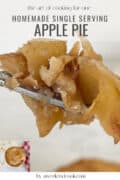 A fork holding a bite of homemade apple pie, with pie and text about single serving apple pie in the background.