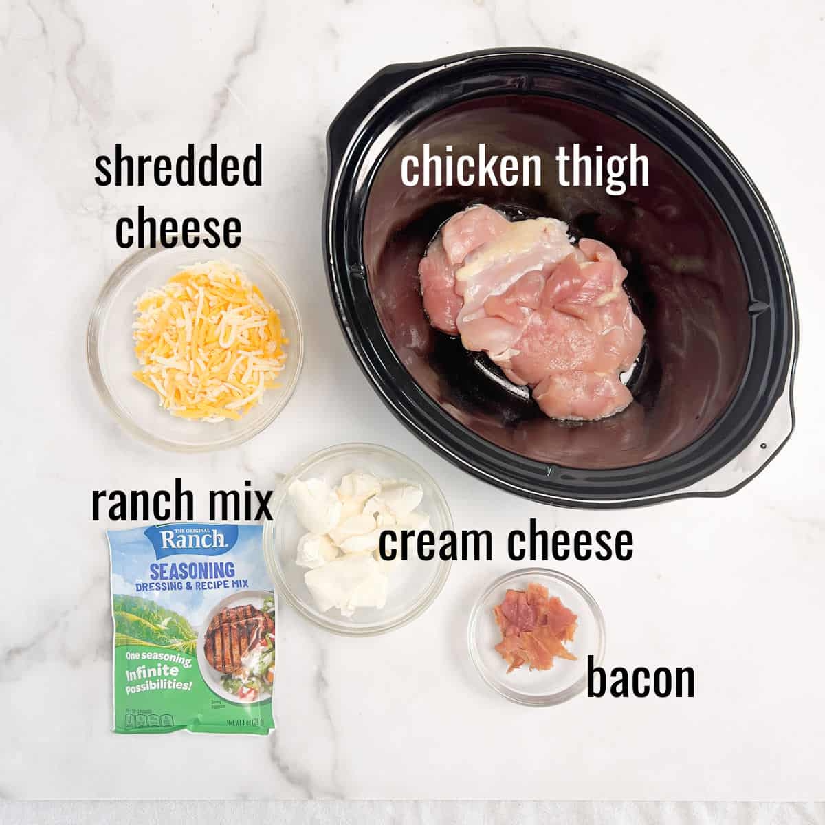Chicken thigh, shredded cheddar cheese, crumbled bacon, ranch dressing mix, and cream cheese.