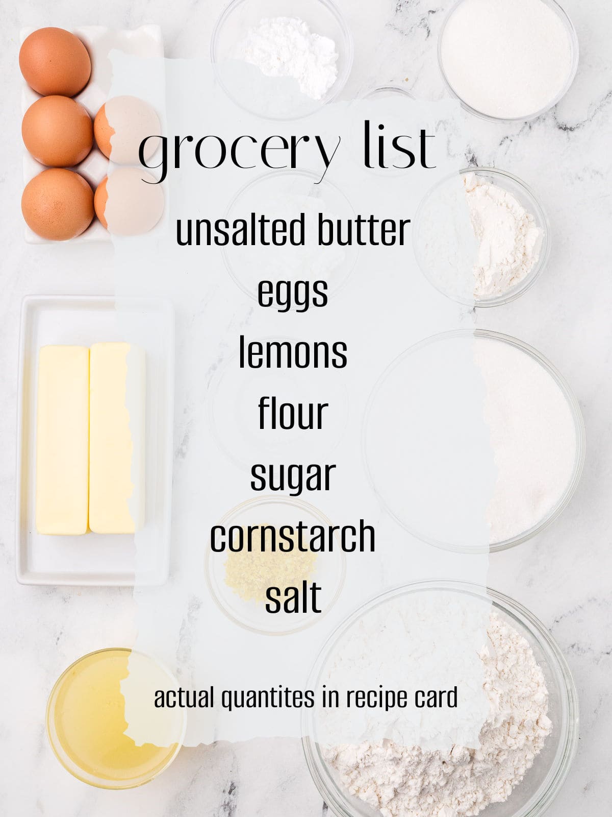 A grocery list with unsalted butter, eggs, lemons, flour, sugar, cornstarch, and salt, surrounded by bowls of the listed ingredients on a marble surface.