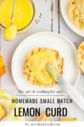 A toasted English muffin topped with lemon curd on a white plate, with a knife, spoon, and a jar of lemon curd on the side. Text reads: Homemade Small Batch Lemon Curd.