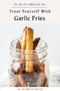 A mason jar filled with garlic fries sits on a white surface, accompanied by text promoting garlic fries for solo cooking by aweekendcook.com.