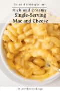 Bowl of creamy macaroni and cheese in white ramekin.