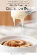 A cinnamon roll in a white ramekin is being topped with drizzled icing. The text above reads Single Serving Cinnamon Roll.
