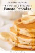 A stack of banana pancakes topped with banana slices and syrup, with text promoting The Weekend Breakfast: Banana Pancakes by aweekendcook.com.