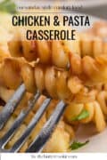 Close-up of a fork holding spiral pasta and chicken pieces from a chicken and pasta casserole dish, with text overlay describing the recipe.