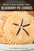 Stacked round blueberry pie cookies with crimped edges and star-shaped slits, these blueberry pie cookies are labeled as a quick and easy summer treat.