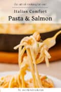 A fork holds a bite of creamy pasta with salmon above a plate, with text overlay about Italian comfort food and cooking for one.