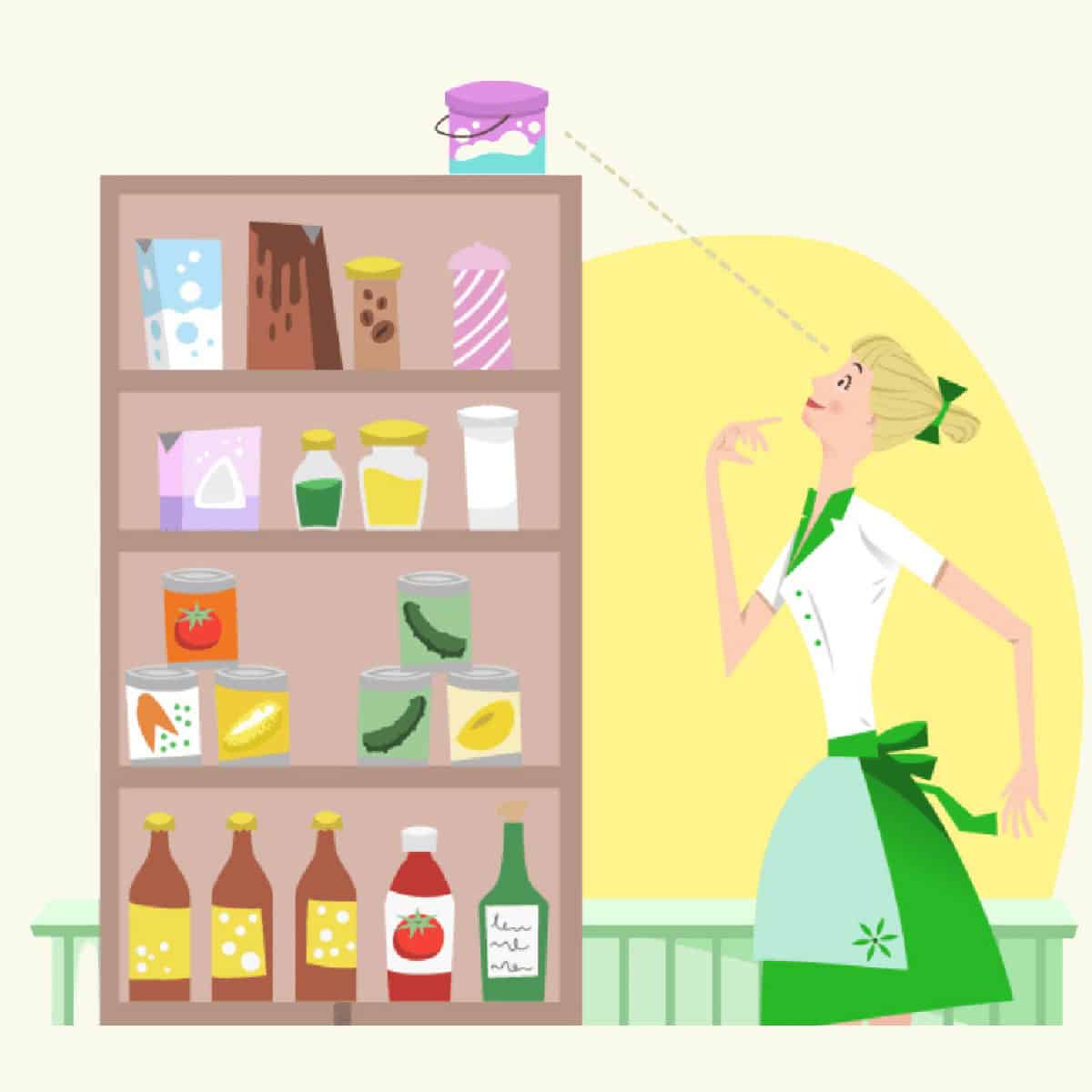 A woman in a green apron looks up at a jar of jam on the top shelf of a pantry filled with food items and preserves, thoughtfully considering how to stock a pantry and reduce food waste.